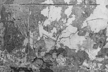 White painted wall with peeling paint and texture for vintage architecture and weathered background...