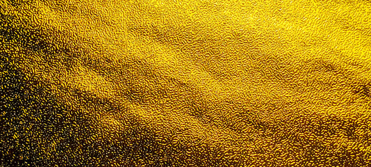 Luxury Gold Foil Paper Texture with Crinkled Metallic Surface and Shimmering Yellow Light Reflection