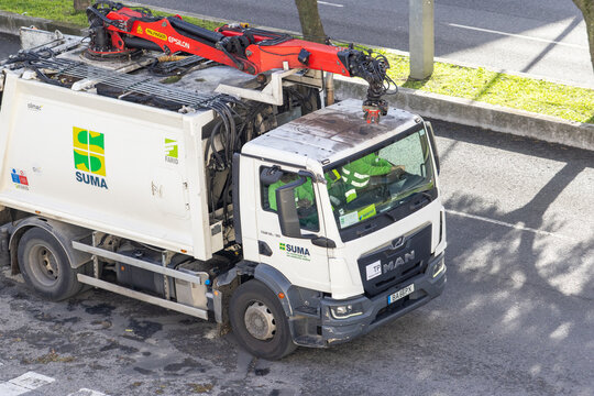 Suma garbage truck collecting waste with epsilon crane