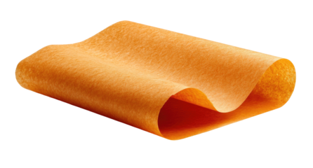 Close-up of a curled sheet of orange paper against a black backdrop