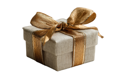 A square gift box is covered in a textured beige material and topped with a golden ribbon bow
