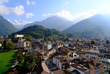 Aerial view of Interlaken townscape with the majestic Alps on sunny day