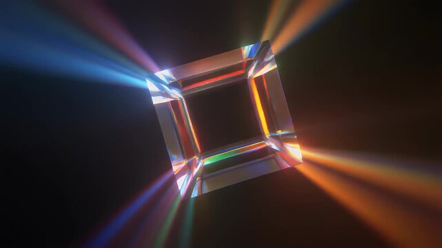 A geometric structure, square and crystalline in form, refracting light. Rays of color emanate from its facets against a dark background