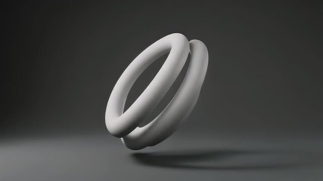 A minimalist 3D rendering featuring two intertwined, smooth, white toroidal shapes floating against a gradient gray background