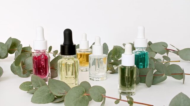Organic Eucalyptus essence oil. Cosmetic bottles with pipette for serum, extract and emulsion. Cosmetics based on natural ingredients. Spa the concept of skin care. High quality 4k footage