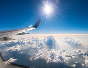 Fototapeta premium bright sky view from airplane window with sun and fluffy clouds