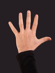 Man hand showing five fingers on a black background