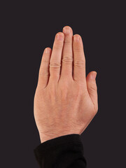 Man hand showing five fingers on a black background