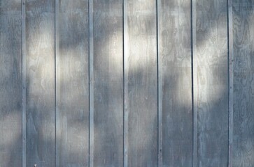texture gray vertical siding wall with shadows background