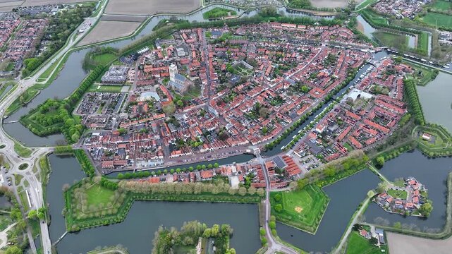 Aerial views of the historic fortified  town of Brielle, Den Briel, The Netherlands. View from the drone of star-shaped Fort Brielle showcasing canals, historic architecture, and vibrant cityscape