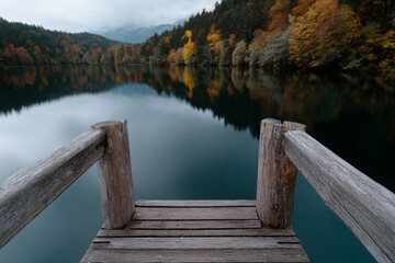 Peaceful lake reflecting the colors of autumn.