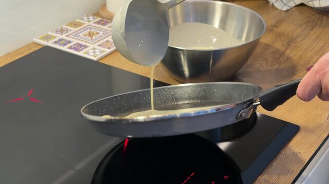 Pouring Pancake Batter into a Hot Frying Pan
