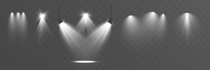 Light spotlight beams set with soft glow on transparent background.
