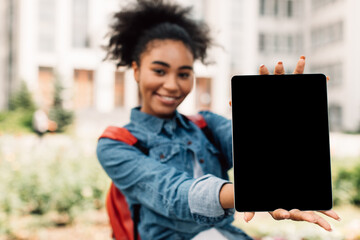 E-Learning. African American Student Girl Showing Digital Tablet With Blank Screen Advertising...