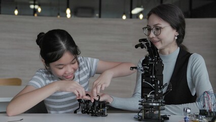 Students learn how to control robots manually in the classroom.