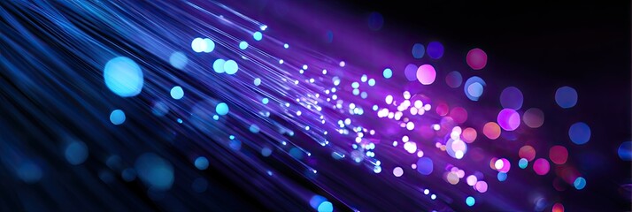 A stylized image showcasing glowing fiber optic strands against a dark background with blurred bokeh effects