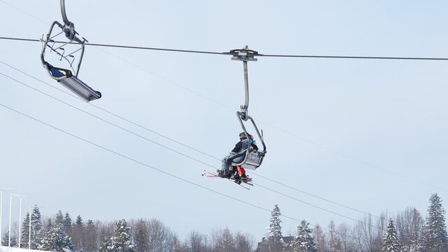 Ski lift malfunctions while carrying passengers in winter setting