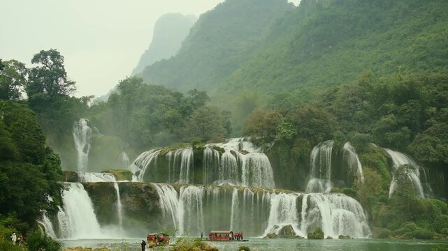 Cao Bằng, Vietnam &mdash; December 23, 2025: The Bản Giốc Waterfall or the Detian Falls, is located on the Qu&acirc;y Sơn River and is part of a UNESCO Global Geopark