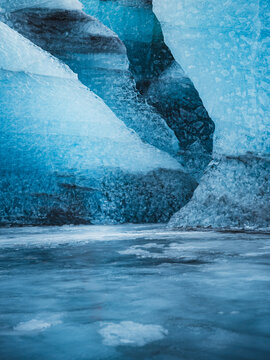View of translucent blue ice formations create a mesmerizing cavernous landscape with shimmering water reflecting the ethereal light, Vatnaj&Atilde;&para;kull National Park, South Iceland, Iceland.