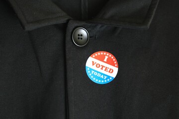 Vote button on clothing, close-up
