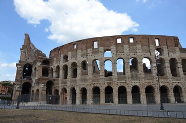 Naklejka premium Rome, Italy 09.02.2019: Colosseum (Coliseum) is one of main travel attraction of Rome, Italy. Ancient Roman ruins of Colosseum, landscape of old Rome city, Italy.