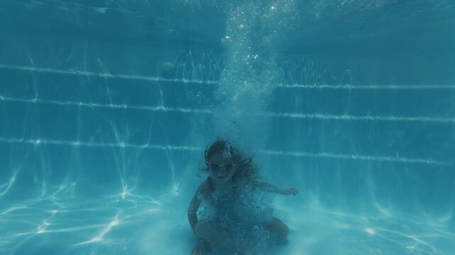 Girl learn jumping in the pool. Pre teen girl jumps in the pool and belly flops