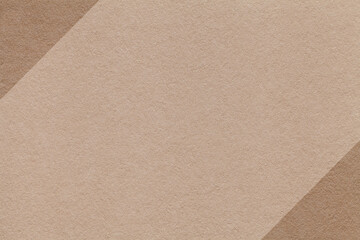 Beige and brown paper texture background with diagonal edges and copy space for banner presentation template