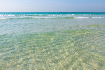 Beautiful beach with turquoise clear water and white sand. Dubai, United Arab Emirates.