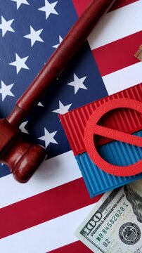 The cargo container ban on the US flag as a conceptual backdrop for the export and logistics of goods. The cargo container embargo on the US flag as a backdrop for your design.