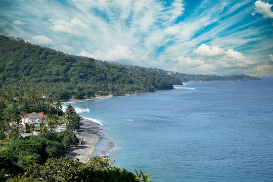 Beautiful view with a dramatic sky over the expansive beach in Senggigi, West Lombok, West Nusa Tenggara (NTB), Indonesia.