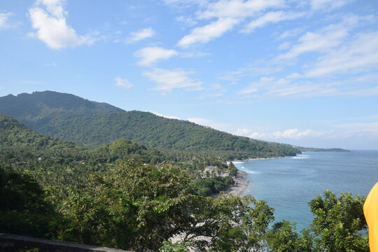Beautiful view with a dramatic sky over the expansive beach in Senggigi, West Lombok, West Nusa Tenggara (NTB), Indonesia.