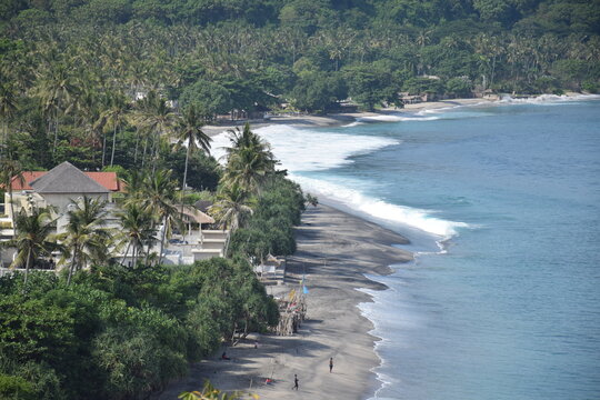 Beautiful view with a dramatic sky over the expansive beach in Senggigi, West Lombok, West Nusa Tenggara (NTB), Indonesia.