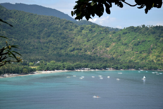 Beautiful view with a dramatic sky over the expansive beach in Senggigi, West Lombok, West Nusa Tenggara (NTB), Indonesia.