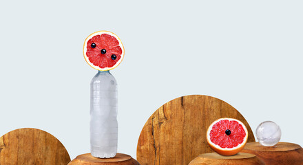 Energetic drinks, isotonic, ice cold conceptual image. Modern drinks wallpaper, sustainability, sliced ​​grapefruit with black berry, frosty plastic bottle. Image manipulation, copy space
