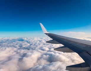 Obraz premium the wings of an airplane flying over the clouds