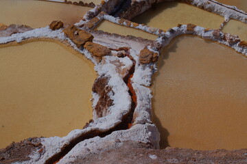 A close-up photo of salt-mining pools in Maras, Cusco Province, Peru.