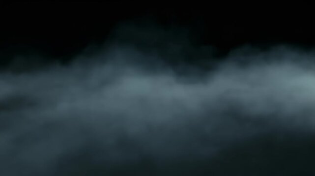 Thick, mysterious blue-grey smoke or fog spreading across a dark, undefined background, creating an atmospheric and ethereal effect.