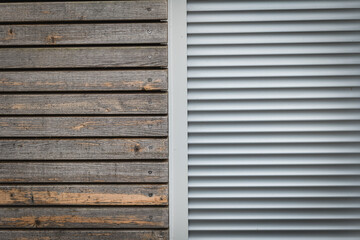 Wood and metal surfaces display contrast in texture and color in a building during daylight