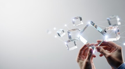 A person holds transparent cubes, representing technology and innovation, with a bright, abstract background enhancing the futuristic theme.