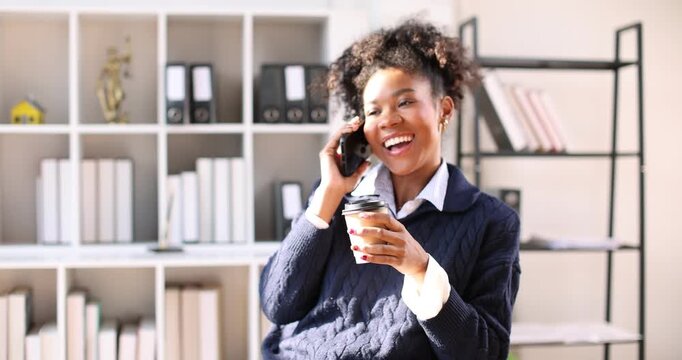 Phone call, laptop and research with Business in afro hair in office for stock broker, account manager and client contact. Market monitor, trade risk and feedback with person talking for investment pl