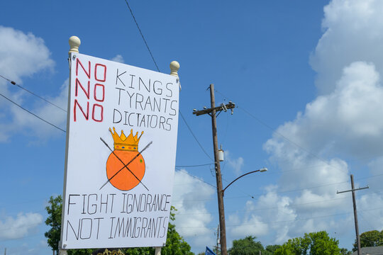No Kings, No Tyrants, No Dictators - Fight Ignorance, Not Immigrants Sign at No Kings March in New Orleans on June 14, 2025