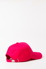 Close-up of a pink baseball cap on a white background