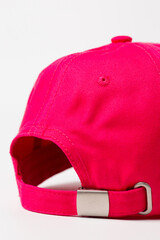 Back view of pink baseball cap with buckle on white background