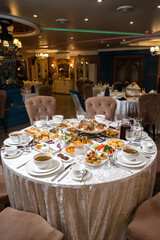 Top view of richly set table with assorted dishes in luxurious restaurant