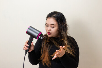 Young Woman Drying Wet Hair with Modern Hair Dryer, Close-up