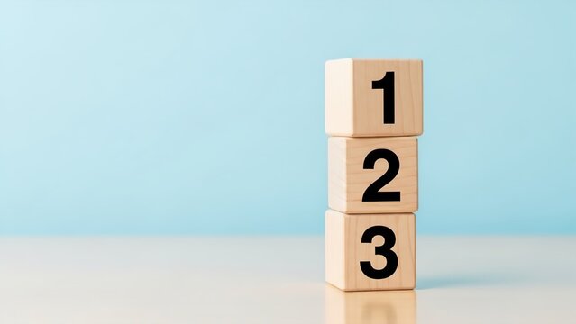 Three wooden blocks stacked vertically with numbers 1, 2, 3 on a light blue background.