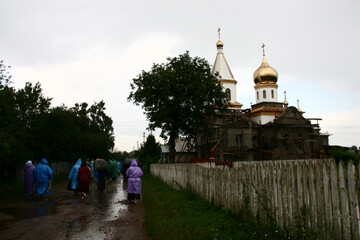 People on the road next to the church