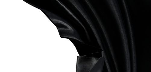 Close up of black fabric showing folds and light reflections, creating a textured abstract background suitable for fashi