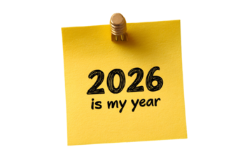 Motivational note on yellow sticky with 2026 is my year