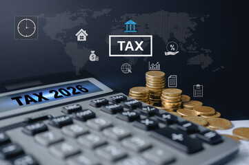 Tax preparation workspace with calculator and gold coins for the year 2026, Tax planning and financial preparation for 2026 with calculator, income tax form, coins